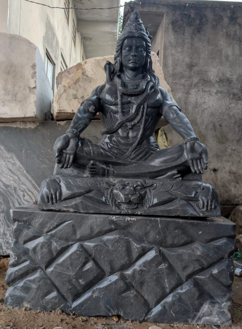 Black granite Shiva in meditation on lion pedestal