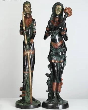 Painted statue of lady in black and green traditional dress wrapped for shipping