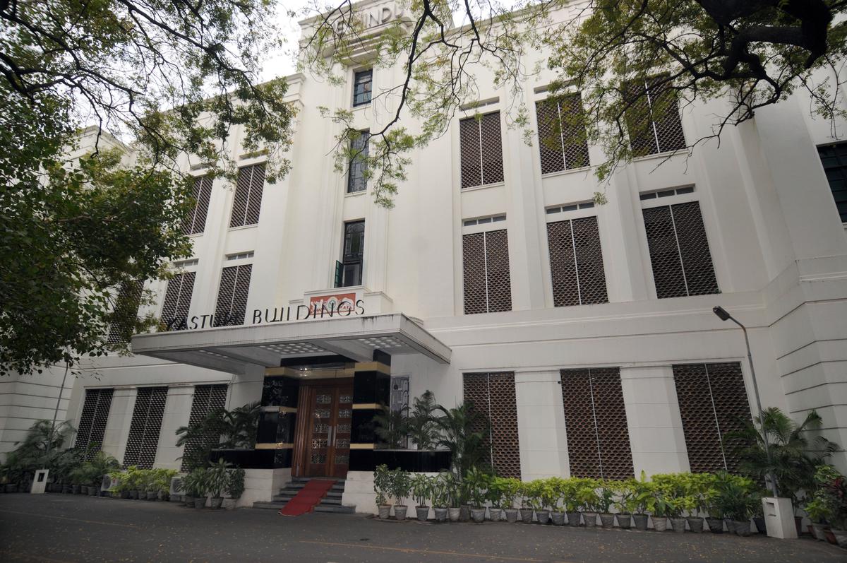 Exterior façade of Kasturi Buildings with natural stone cladding.